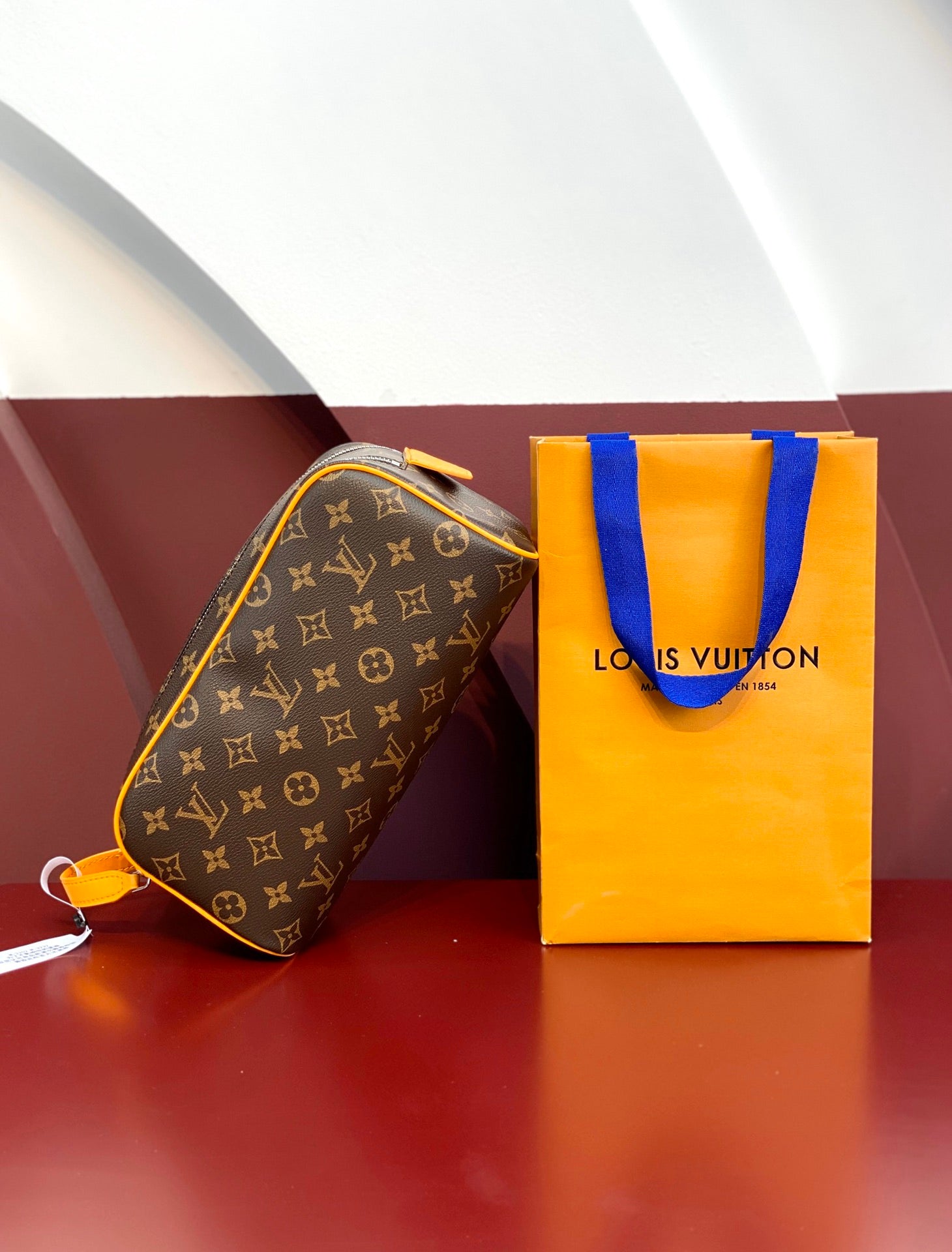 Louis Vuitton monogram toiletry bag with yellow trim and zip closure