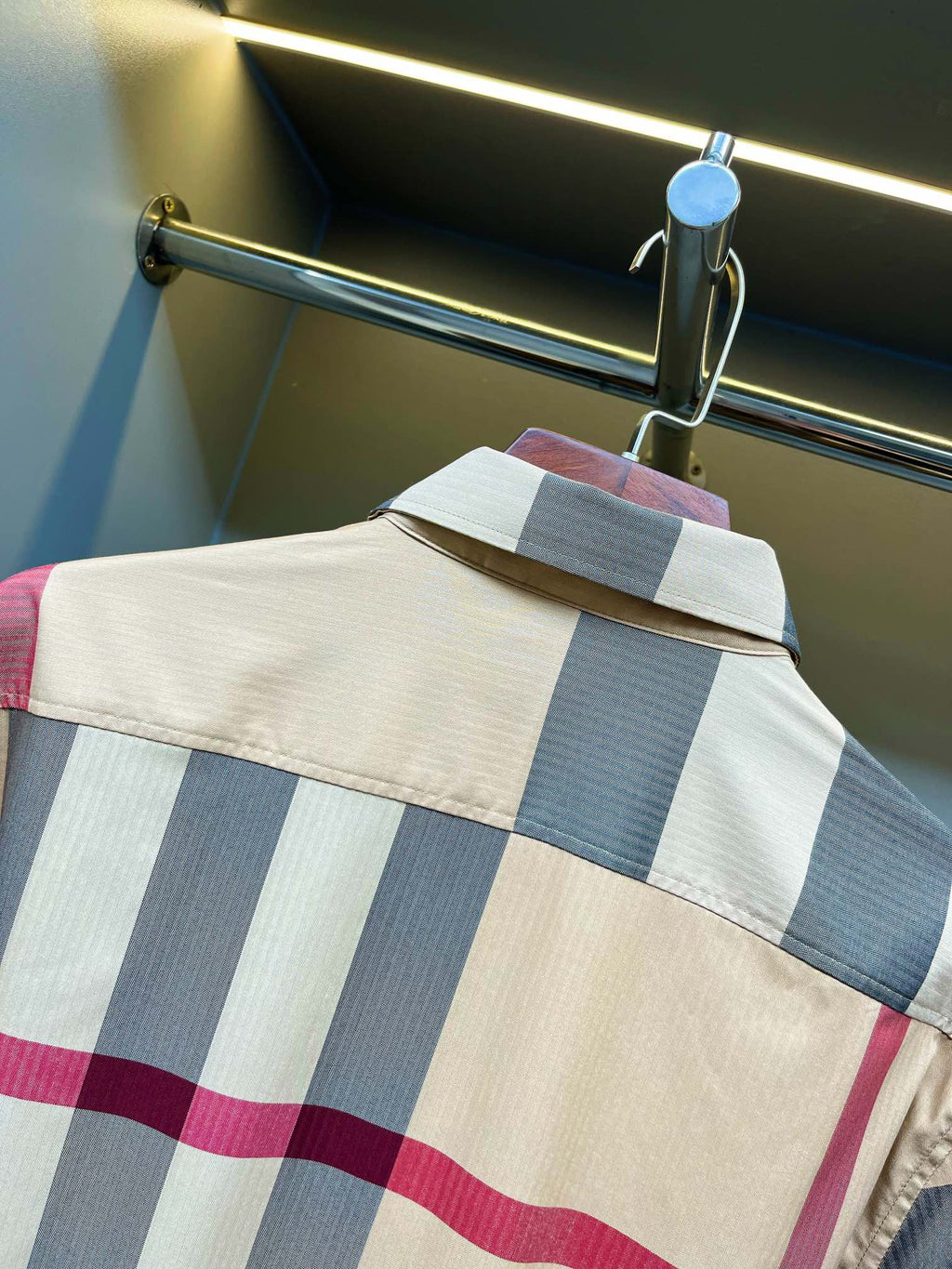Burberry plaid shirt yoke close-up with blue and pink stripes and buttoned shoulder