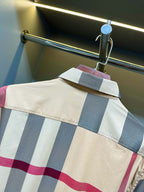 Burberry plaid shirt yoke close-up with blue and pink stripes and buttoned shoulder