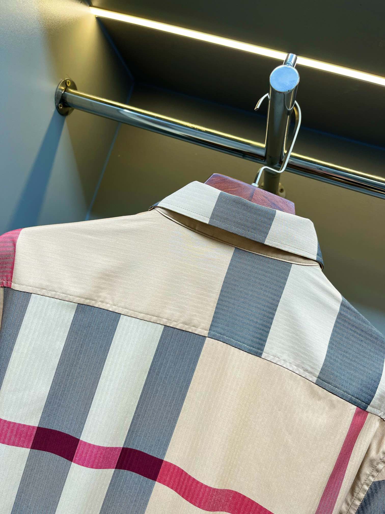 Burberry plaid shirt yoke close-up with blue and pink stripes and buttoned shoulder