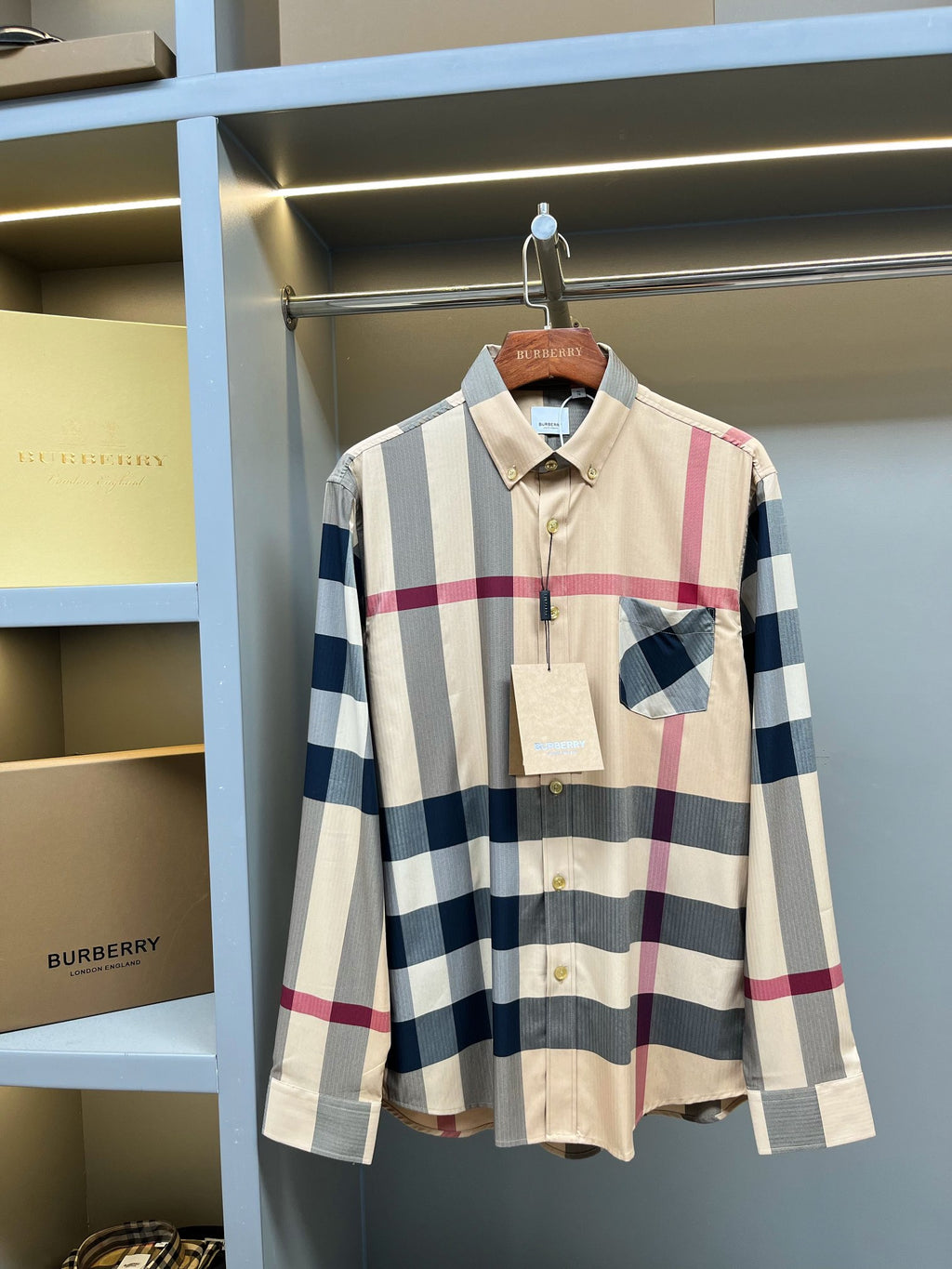 Burberry button-up plaid shirt with long sleeves, button front, and pointed collar