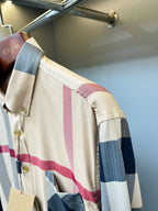 Burberry plaid button-up shirt side view, long sleeves, gold buttons, chest pocket