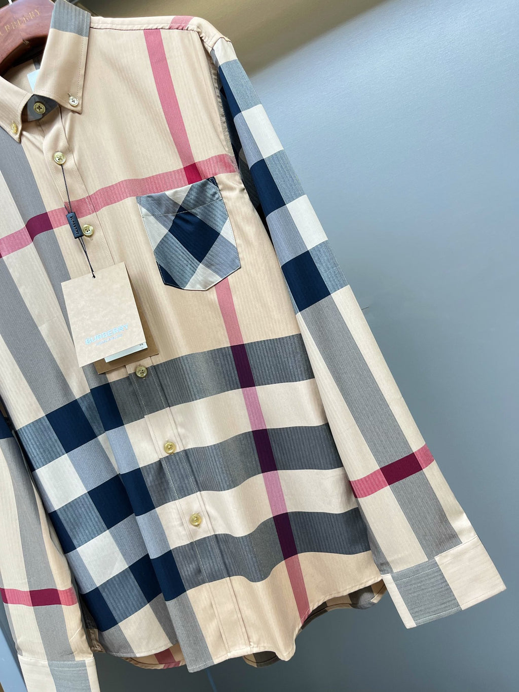 Burberry plaid button-up shirt with pocket detail and long sleeves, gold button front