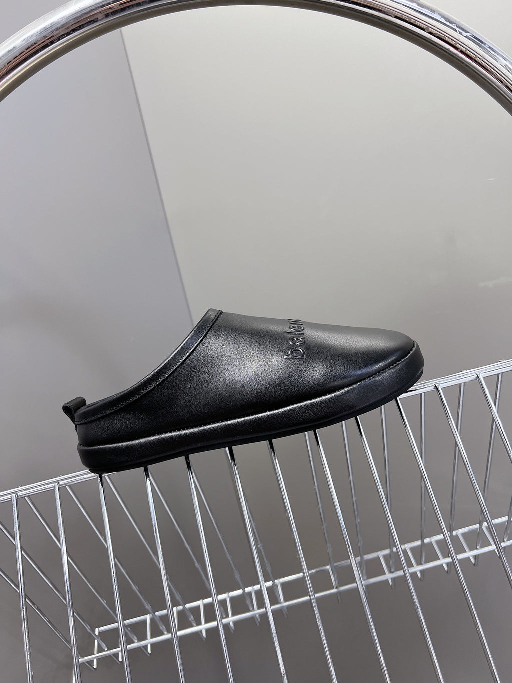 Black leather clog-style slide sandals with open heel