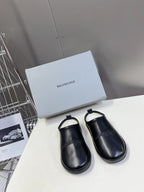 Balenciaga black leather slide sandals, cushioned footbeds