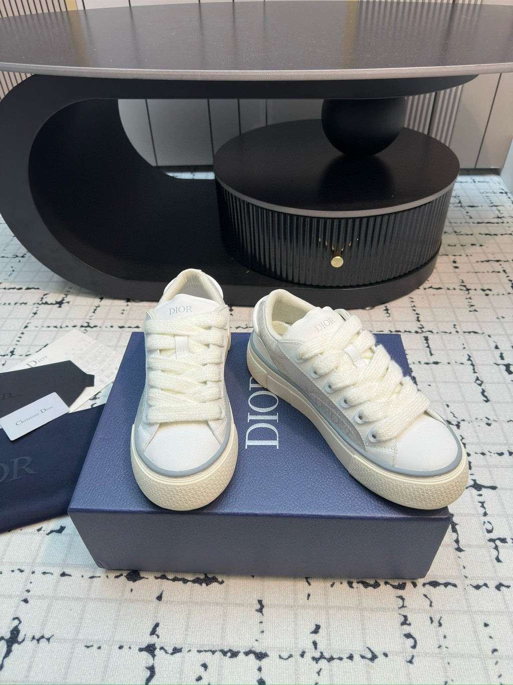 Dior unisex lace-up sneakers, white leather, side-by-side angle view