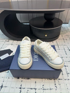 Dior unisex lace-up sneakers, white leather, side-by-side angle view