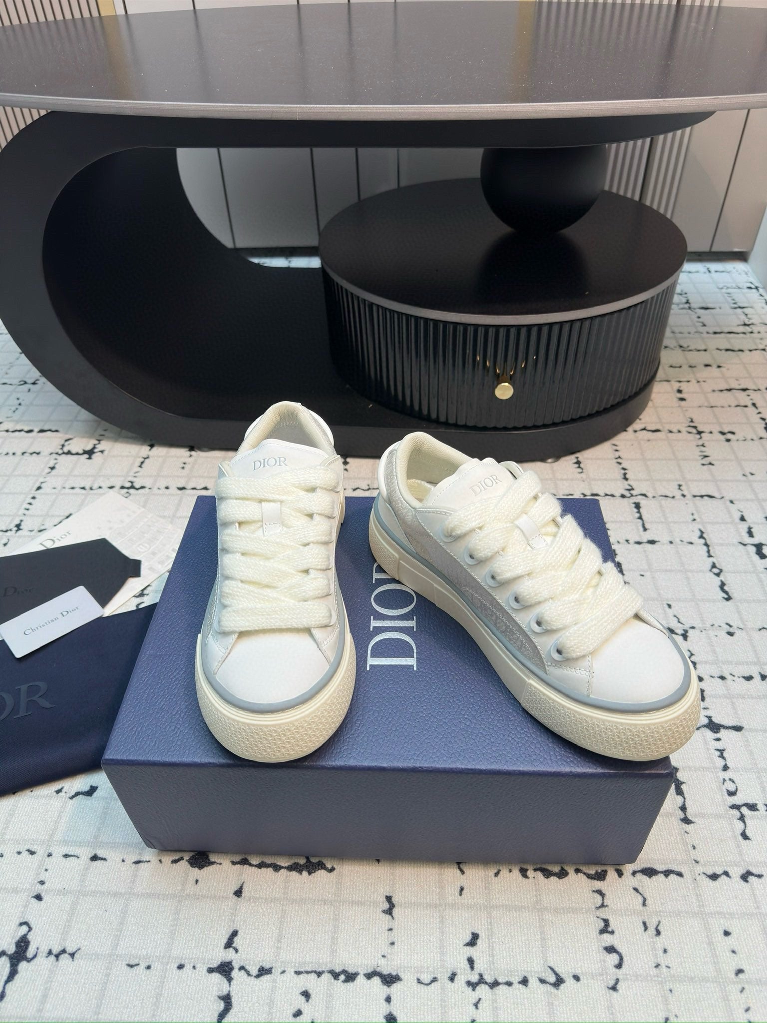 Dior unisex lace-up sneakers, white leather, side-by-side angle view