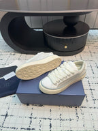 Dior unisex sneakers, white leather, tread outsole and toe view