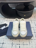 Dior unisex lace-up sneakers, white leather, front view pair