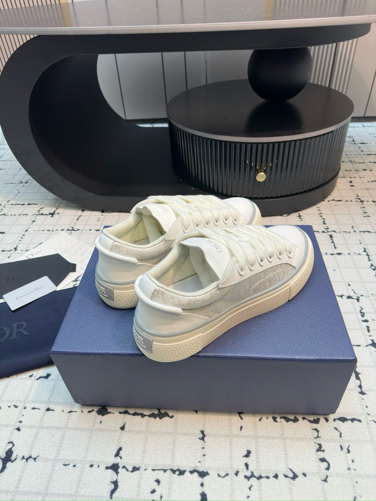 Dior unisex lace-up sneakers, white leather, angled view of uppers