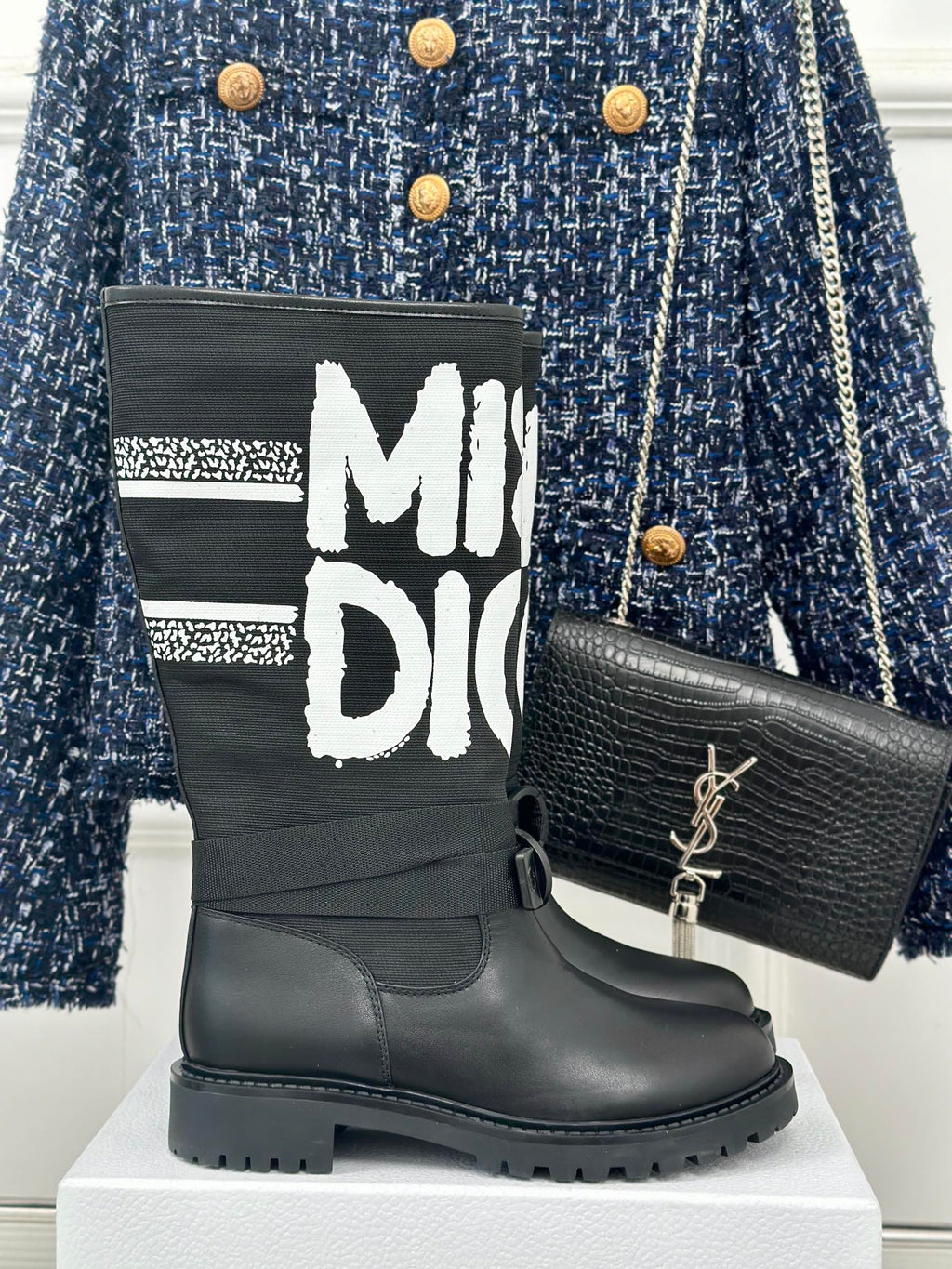Black Dior logo ankle boots with chunky rubber sole and lace-up straps
