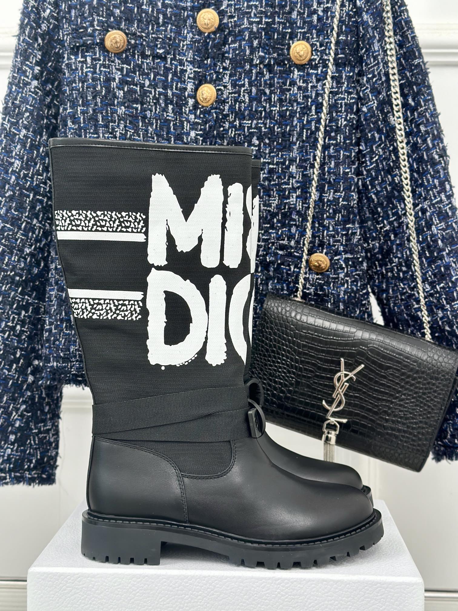 Black Dior logo ankle boots with chunky rubber sole and lace-up straps