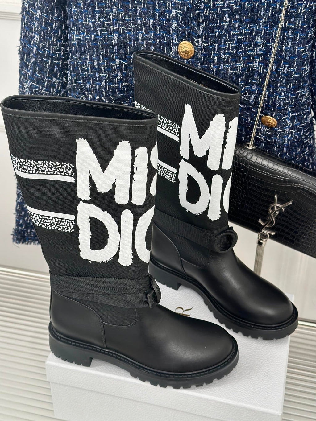 Pair of black Dior logo mid-calf boots with lace-up ties and flat heel