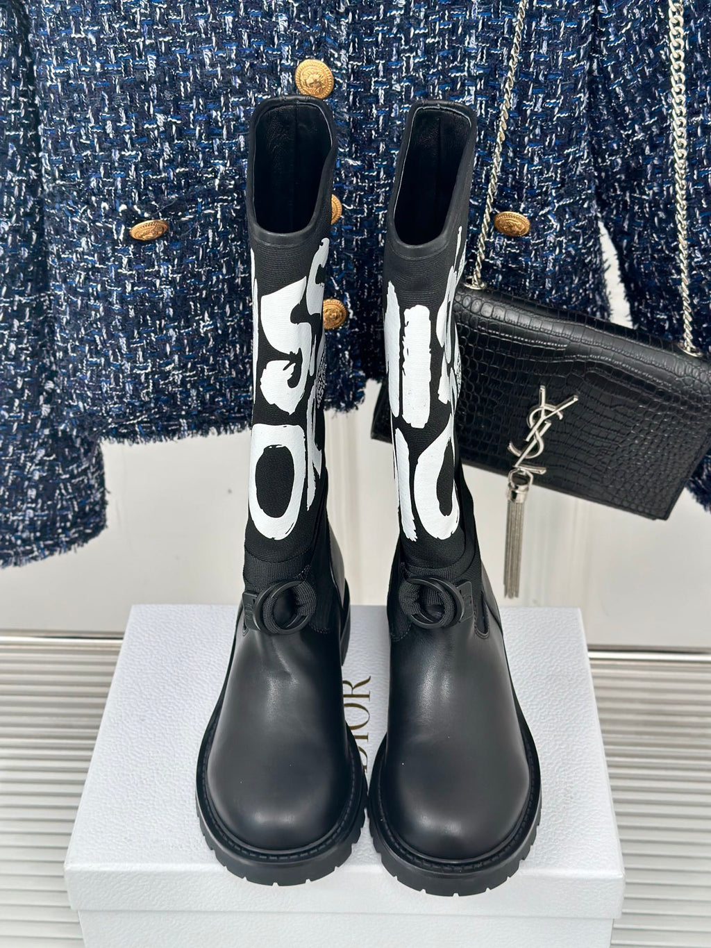 Black Dior logo mid-calf boots with gold YSL detail on the side and lace-up strap