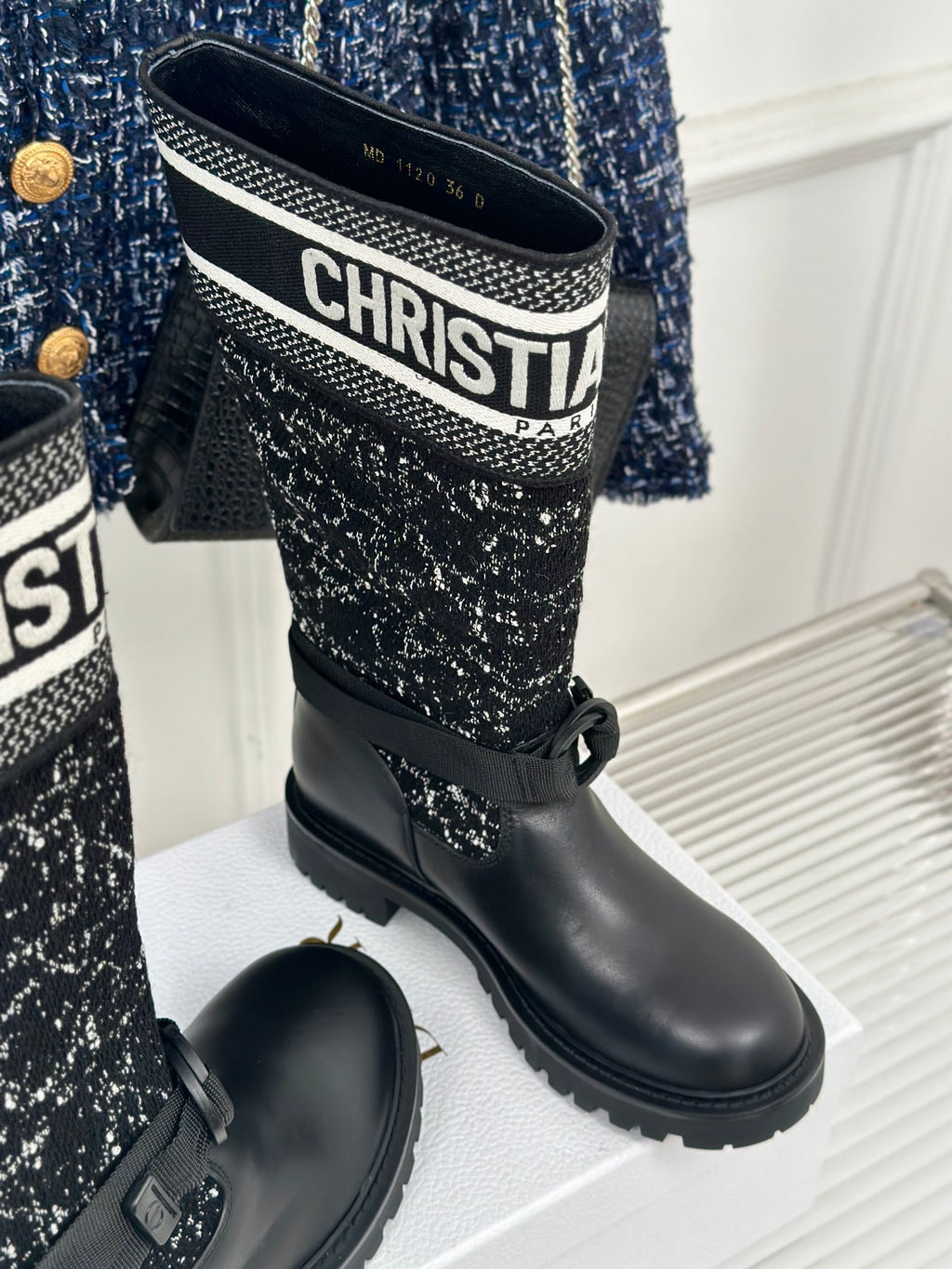 Black leather boots with textured fabric shaft and Dior logo band on collar