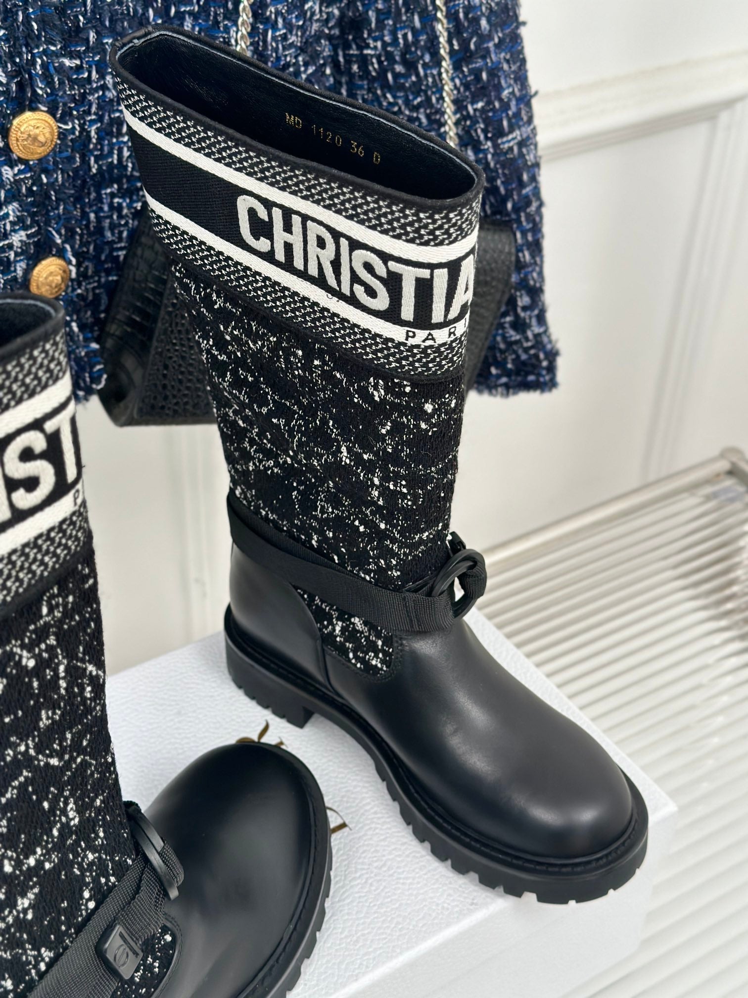 Black leather boots with textured fabric shaft and Dior logo band on collar