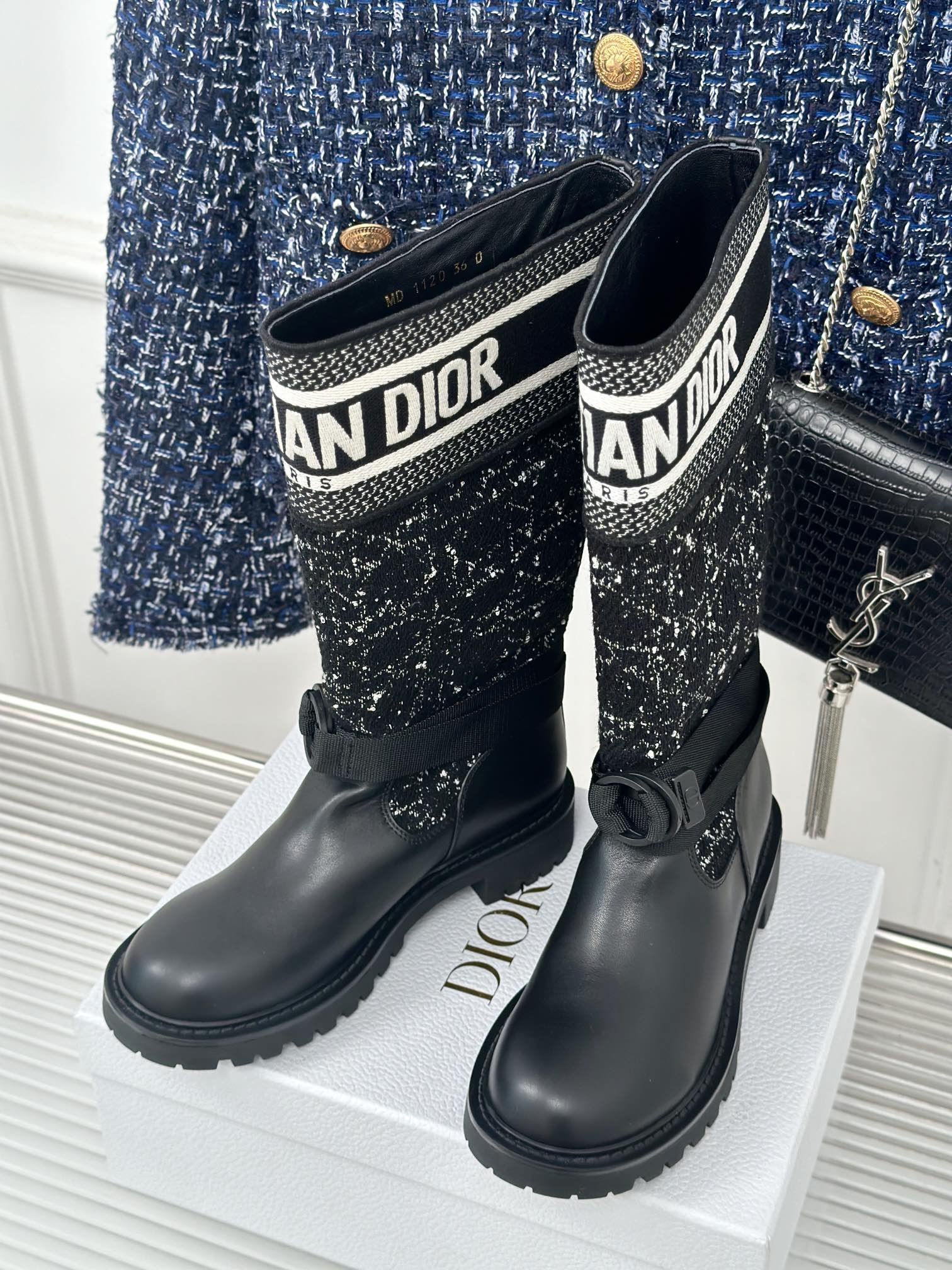 Pair of black boots with patterned fabric shaft and Dior logo trim, low heel