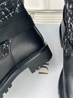 Black boot with smooth leather upper and ribbed sole edge detail