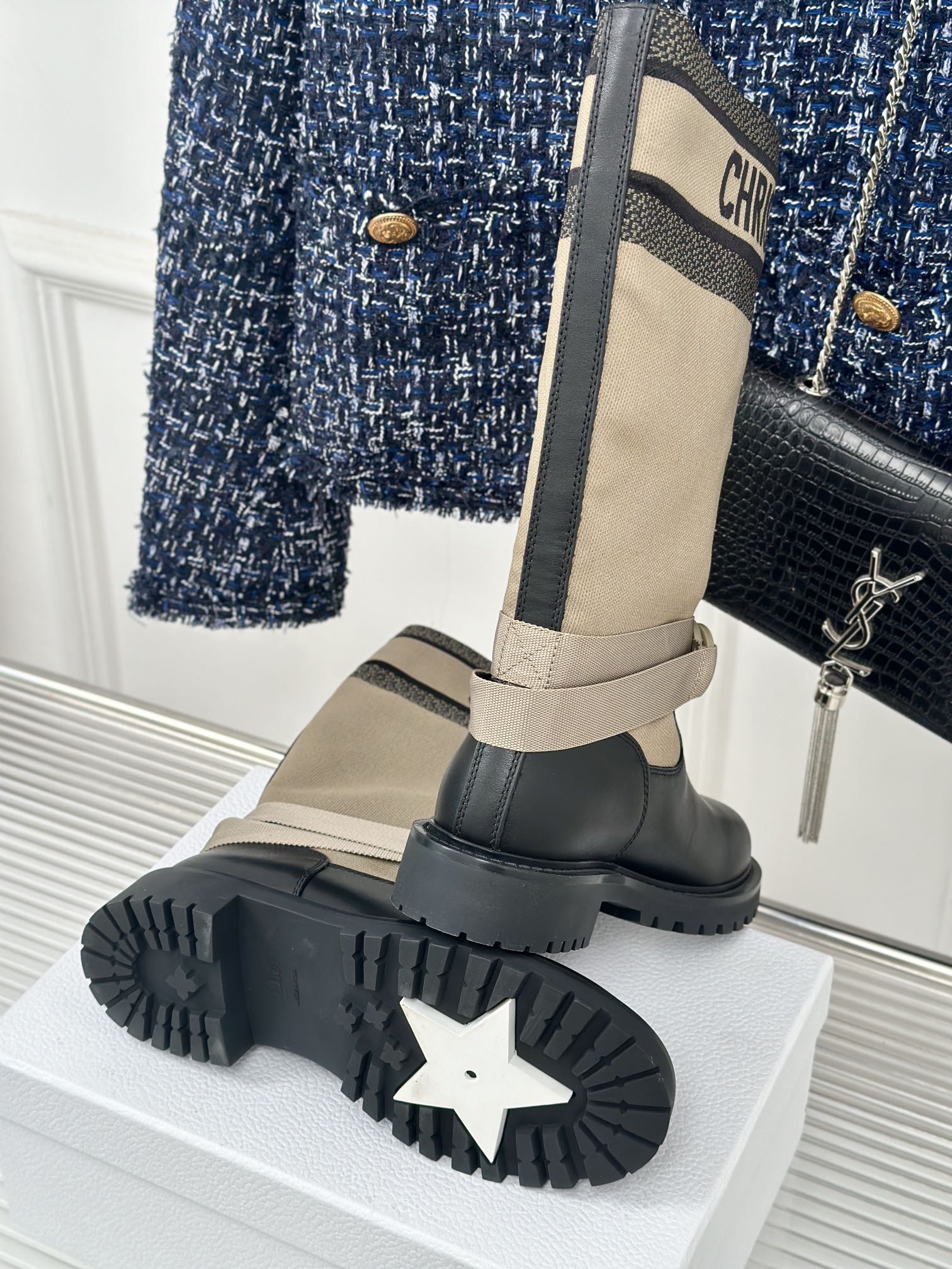 Women’s Dior ankle boots outsole view, black lug sole with star-like tread