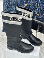 Black ankle boots with logo cuff and round buckle tabs