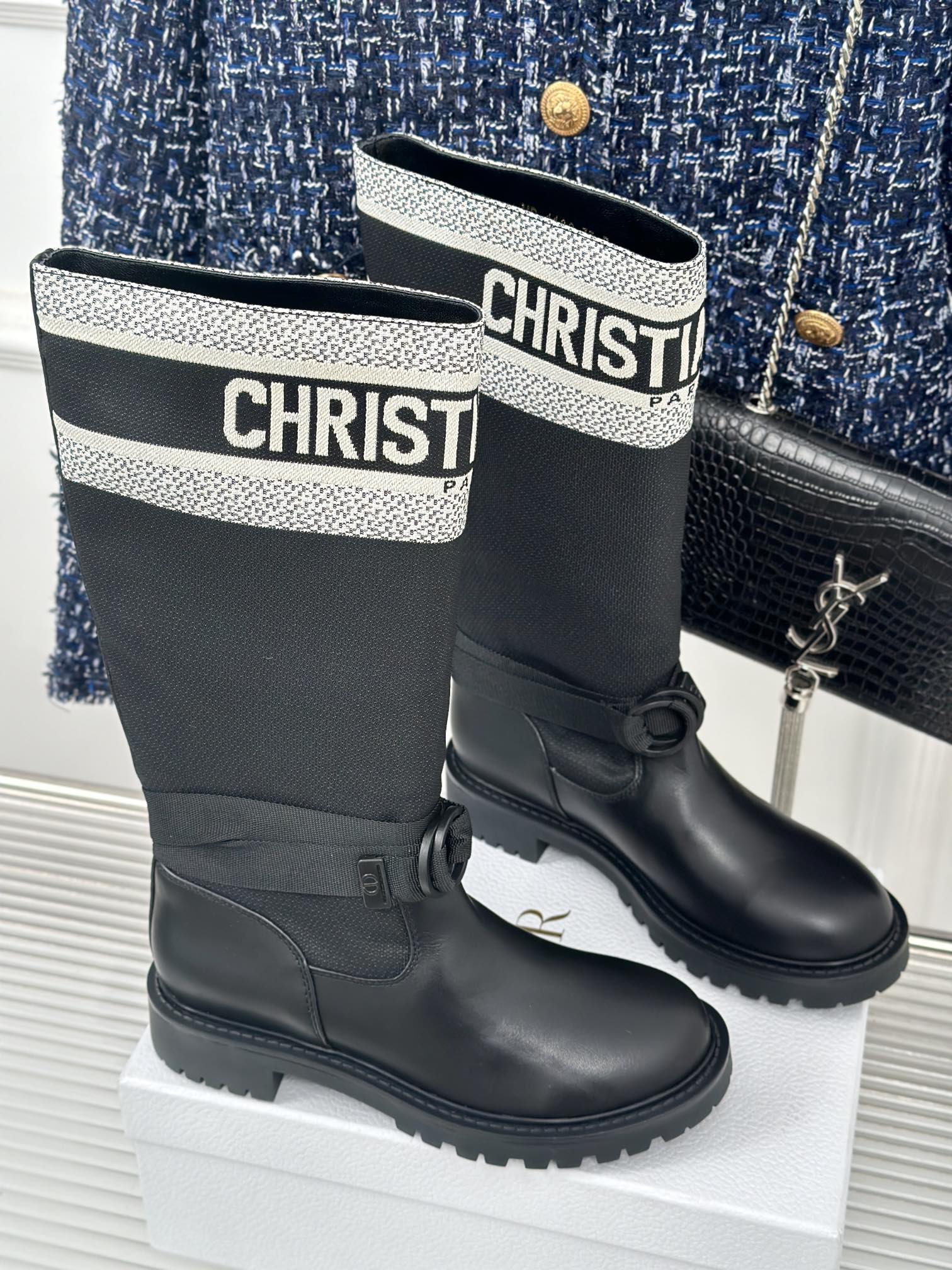 Black ankle boots with logo cuff and round buckle tabs