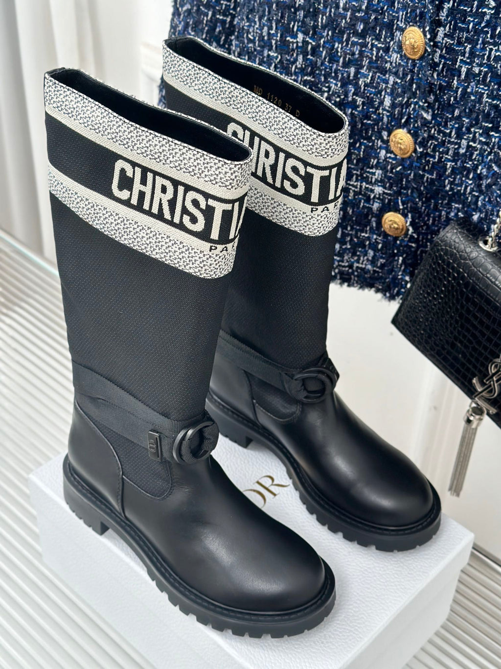 Black ankle boots with patterned logo collar and side bow detail