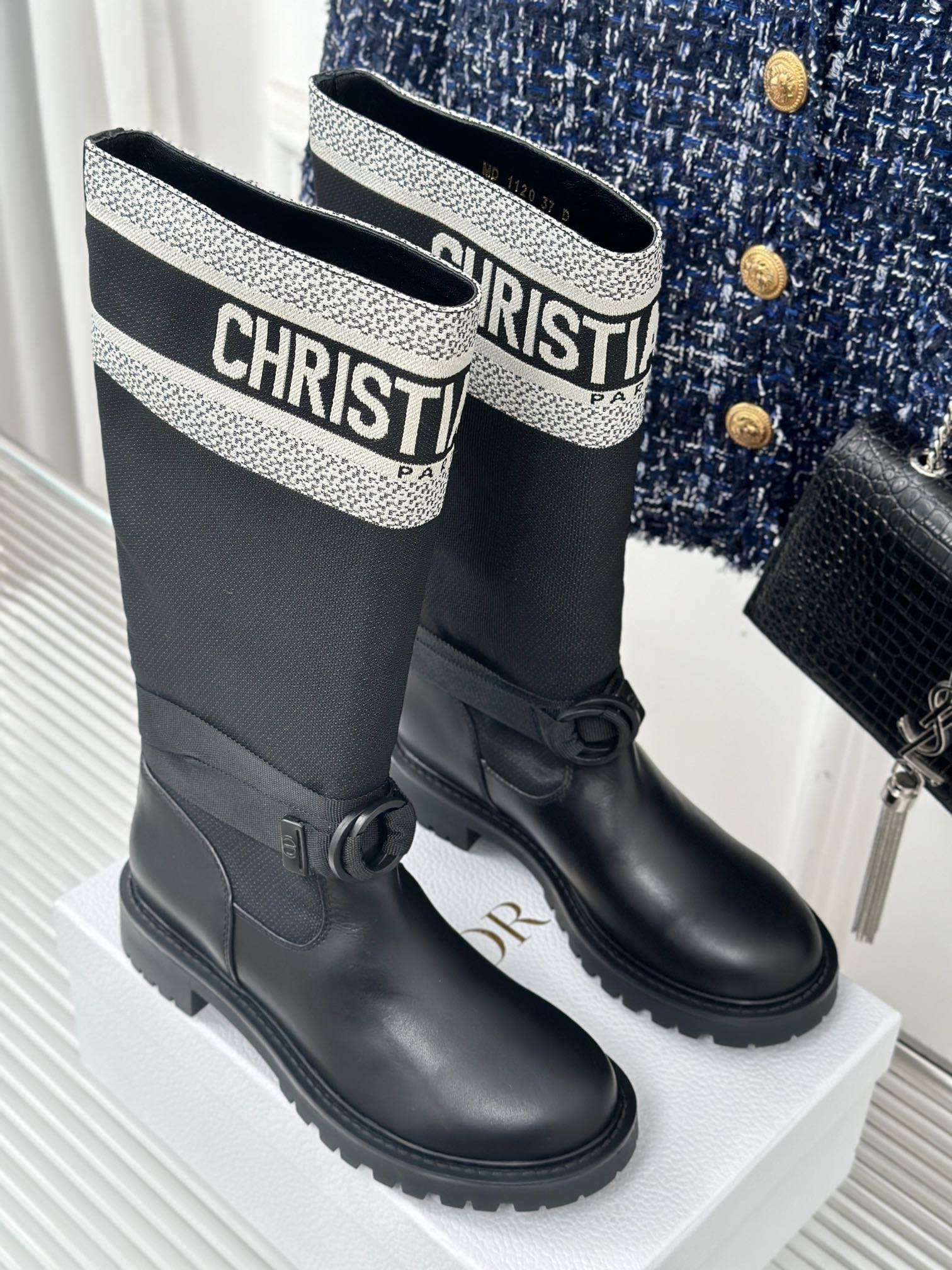 Black ankle boots with patterned logo collar and side bow detail