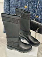 Dior ladies black leather mid-calf boots with buckle straps and tread sole