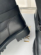 Dior ladies black leather boot side and heel, showing ridged rubber sole