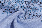 Light blue knit sweater fabric detail with speckled graphic pattern
