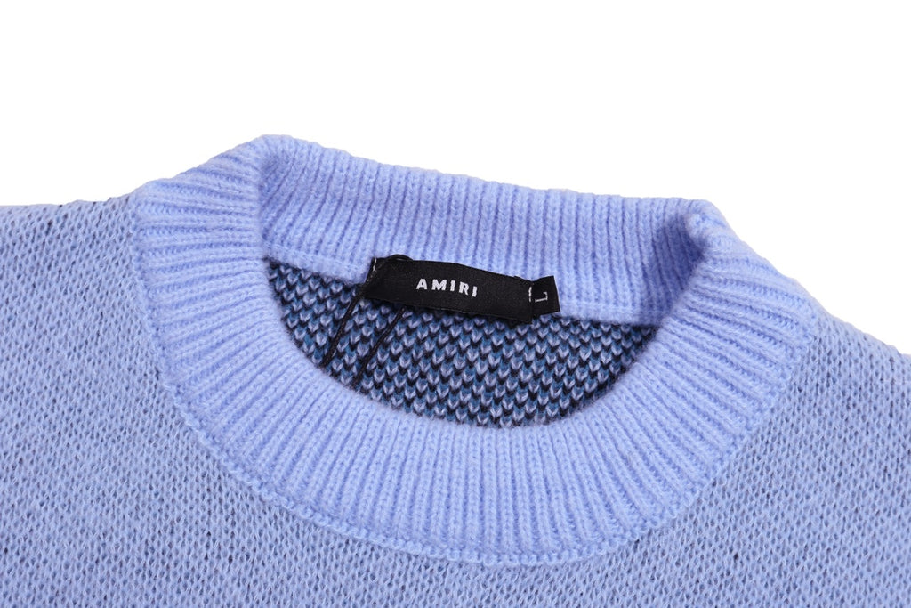 Light blue knit sweater collar with AMIRI label and ribbed neckline