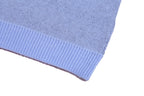 Light blue knit sweater hem with ribbed band