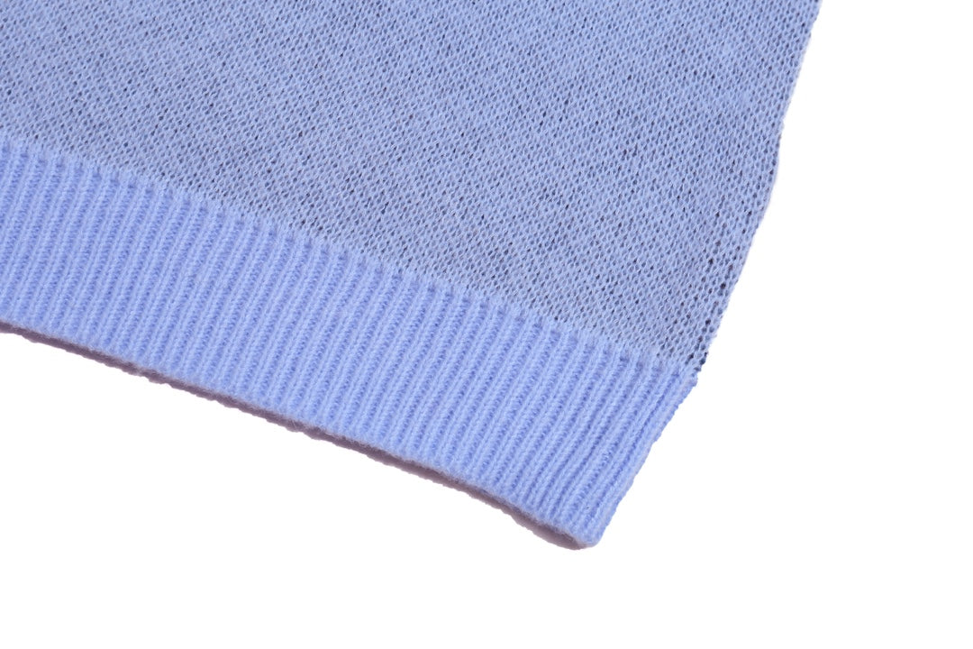 Light blue knit sweater hem with ribbed band