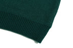 Green ribbed knit cuff detail on sweater sleeve