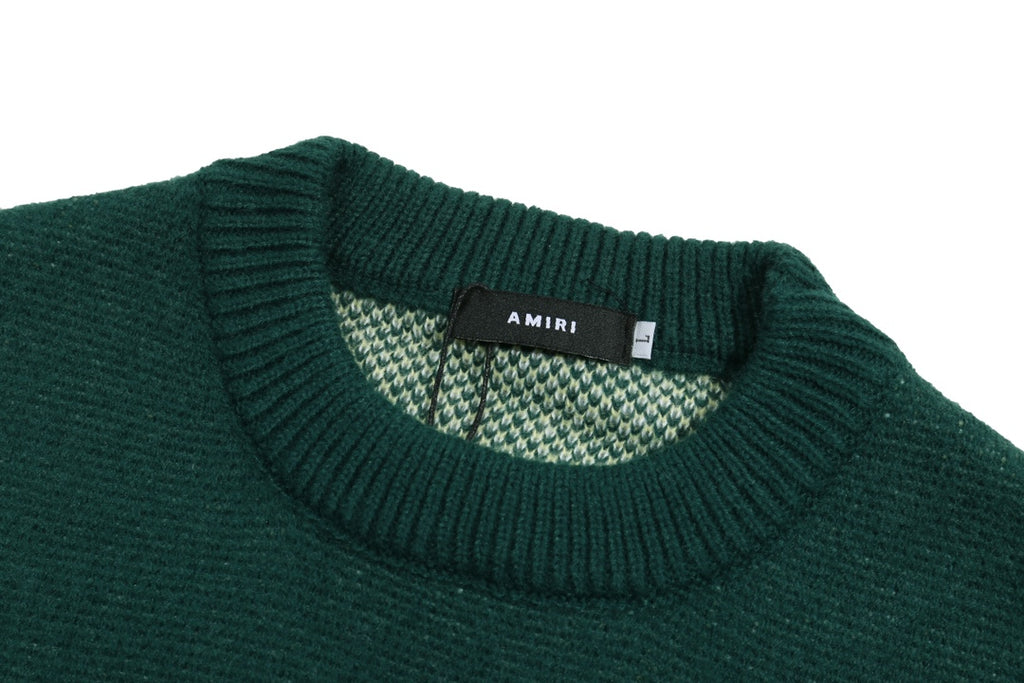 Green crewneck sweater collar with ribbed trim and interior knit label