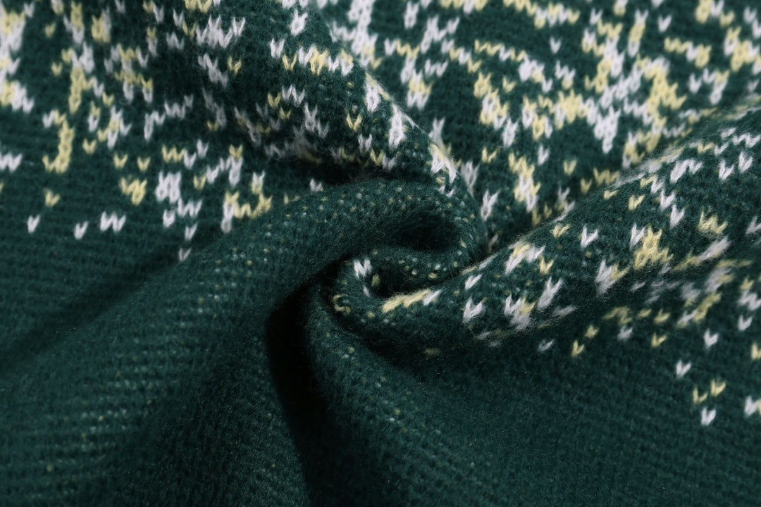 Close-up of green knit sweater with speckled pattern texture
