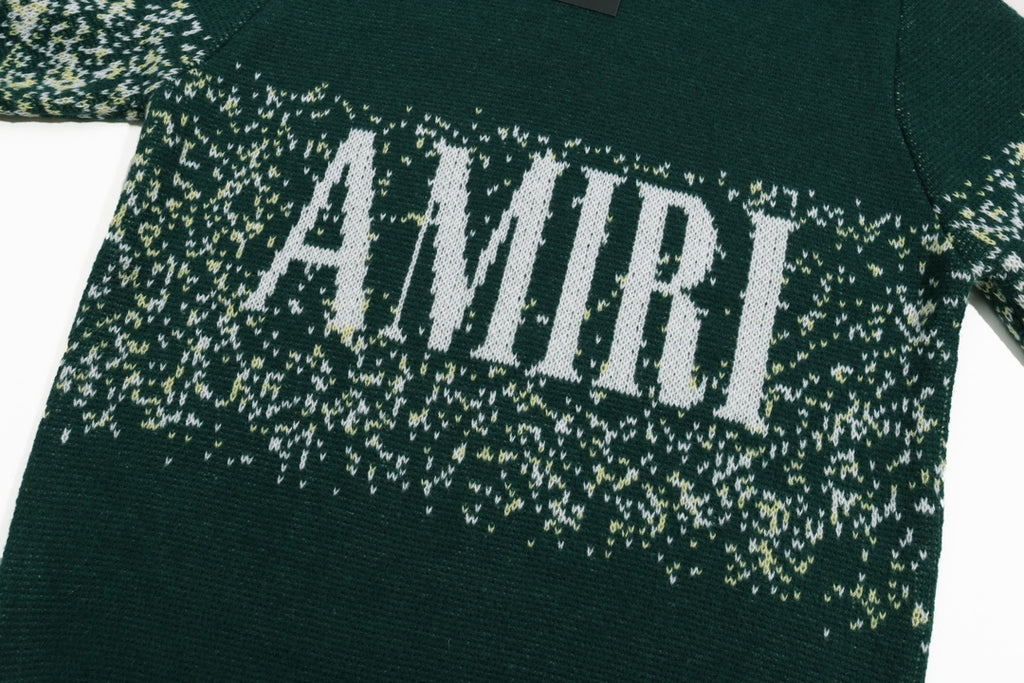 Green sweater with large AMIRI logo across speckled knit band