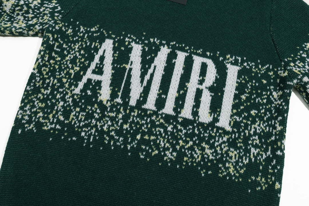 Green sweater with large AMIRI logo across speckled knit band