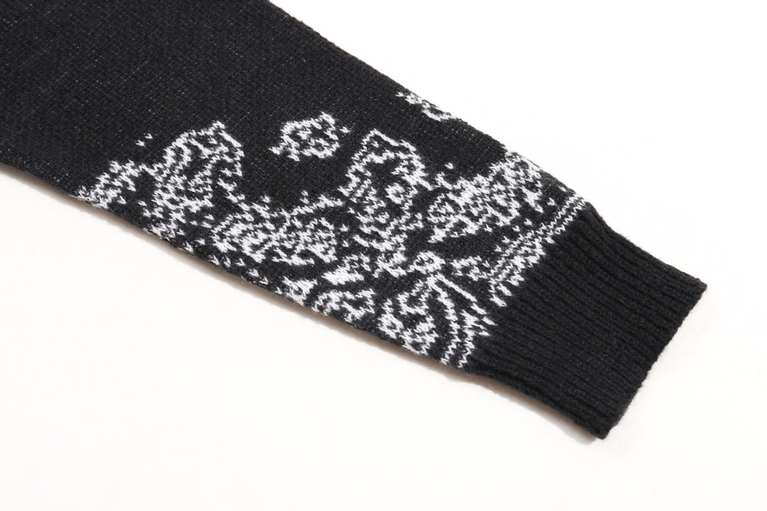 Black sleeve cuff with white jacquard pattern and ribbed knit trim