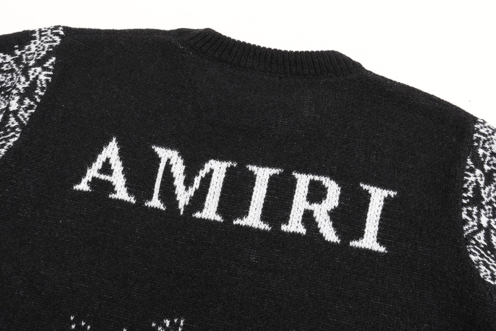 Black sweater back with large white AMIRI text and jacquard band at hem