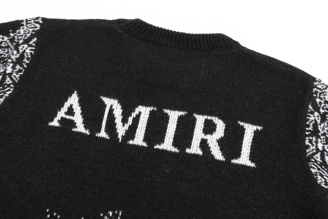 Black sweater back with large white AMIRI text and jacquard band at hem