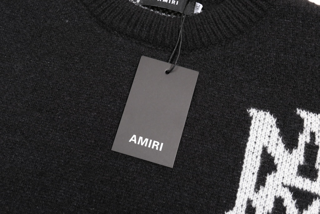 Black knit sweater with AMIRI neck label and hanging price tag