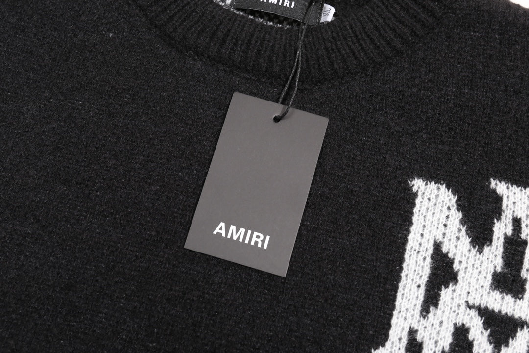 Black knit sweater with AMIRI neck label and hanging price tag