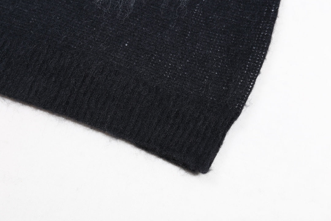 Dark knit sweater hem with ribbed cuff edge