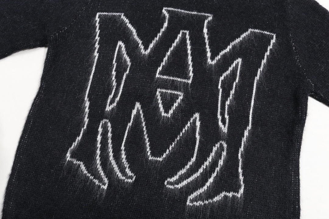 Amiri knit sweater front close-up with white outlined logo graphic