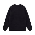 Black crewneck knit sweater with long sleeves, plain back, ribbed cuffs