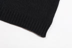 Black ribbed sweater hem and sleeve cuff detail
