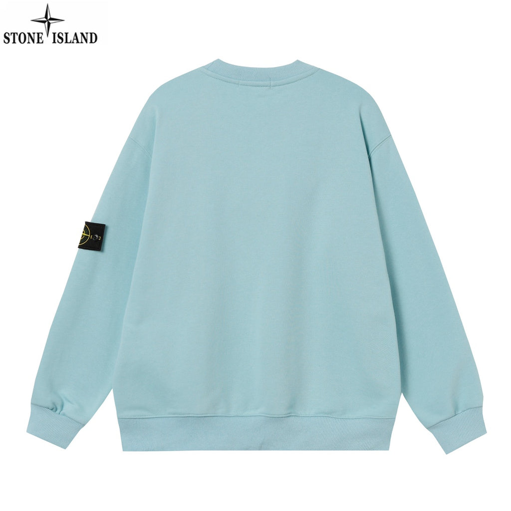 Light blue crewneck sweatshirt, back view, with ribbed hem and sleeve patch