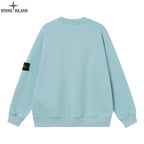 Light blue crewneck sweatshirt, back view, with ribbed hem and sleeve patch